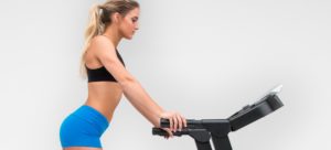 Is it OK to hold the front handlebars while exercising on my treadmill